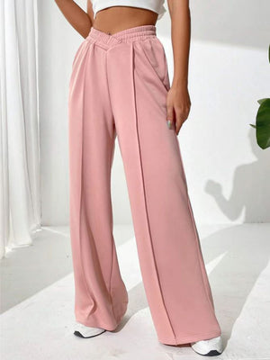 Blush pink palazzo sweatpants with V-waistline and center seams
