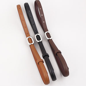 Sleek cowhide leather belts in coffee brown, black, and brown with oval silver buckles.