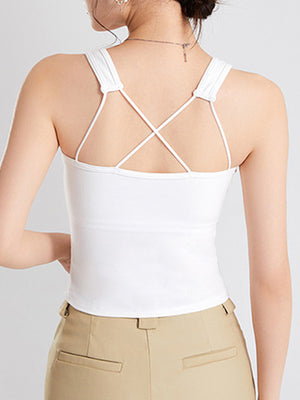 White crop tank top with crisscross spaghetti straps and a square neckline.