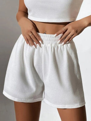 White ribbed knit crop top and high-waist shorts set with elastic waistband.