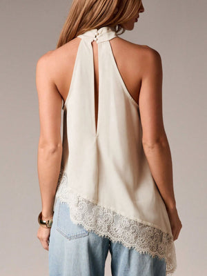 Beige halter camisole with lace trim and asymmetrical hem, back detail.
