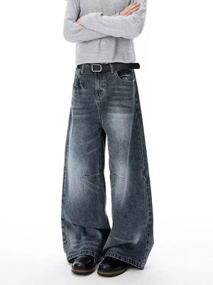 Men's dark wash wide-leg jeans with a belted waist and vintage-inspired details.