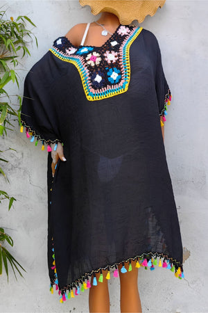 Black kaftan dress with colorful crochet yoke and tassel trim on sleeves and hem