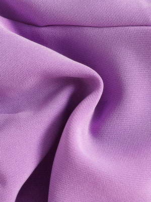 Purple cotton baby set fabric detail with subtle texture