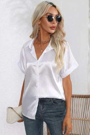 White satin button-down blouse with cuffed short sleeves and a V-neck.