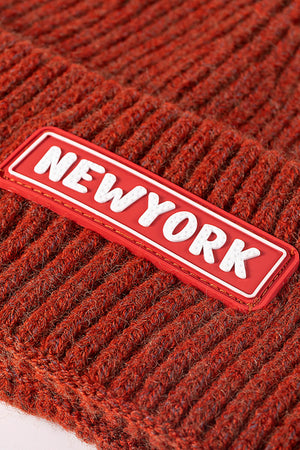 New York patch ribbed acrylic beanie in rust with a red patch.
