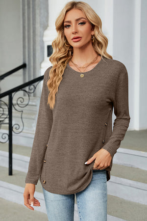 Mocha knit sweater with side button detail and slit hem.
