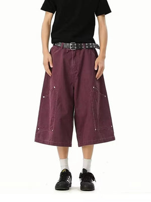 Relaxed fit purple cargo shorts with utility pockets and white stitching.