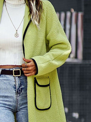 Lime teddy coat with contrast trim detailing and pocket.