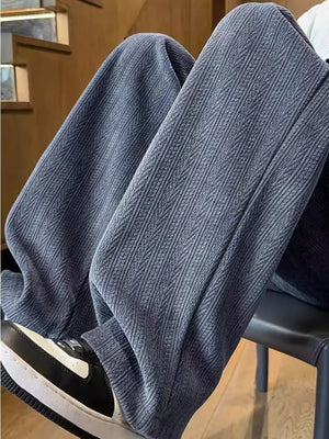 Textured wide leg sweatpants in gray with a subtle herringbone pattern.