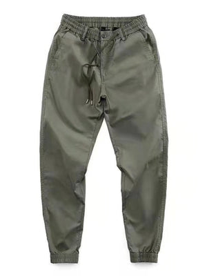 Men's khaki drawstring joggers with a relaxed fit and elastic cuffs.