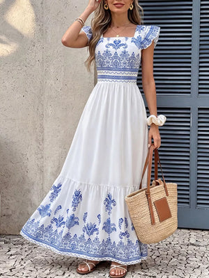 Printed square neck maxi dress with blue and white bohemian pattern, ruffled sleeves, and tiered skirt.