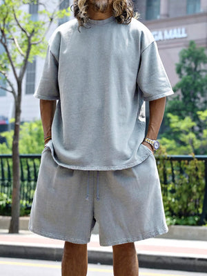 Men's light gray relaxed fit two-piece set with drawstring shorts and crew neck t-shirt.