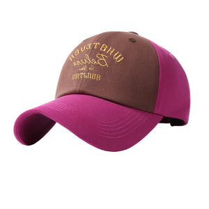 Embroidered two-tone baseball cap in brown and purple with gold text detail.