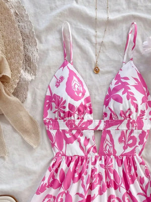 Vibrant floral cutout mini dress with deep V-neck and spaghetti straps.