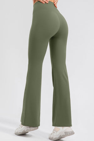 Matcha green flared leggings with a high waist, shown from the back.