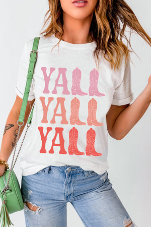 White graphic tee with Y'all and cowboy boot print in pink and coral ombre.