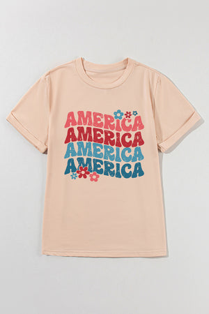 Tan t-shirt with stacked "America" graphic and flowers, 70s-inspired style