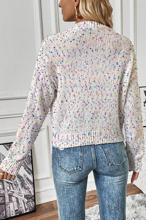 Confetti knit button-up cardigan in white with multicolor speckles, crew neck, long sleeves, and ribbed trim.