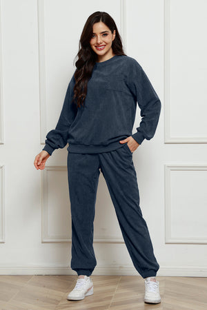 Dark Blue corduroy lounge set with crew neck sweatshirt and jogger pants, featuring pocket detail.