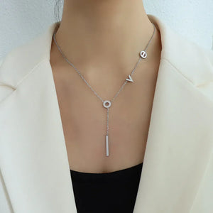 Silver Love Letter Pendant Necklace with bar drop detail.