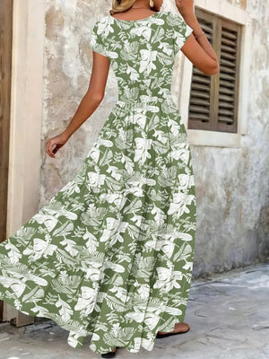 Green floral tiered maxi dress with short sleeves and smocked bodice.