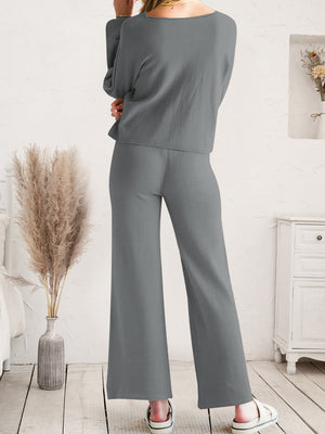 Dark gray acrylic wide-leg loungewear set with long sleeves and a relaxed fit.