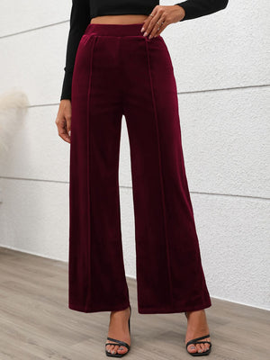 Burgundy velvet palazzo trousers with seam detail and wide leg