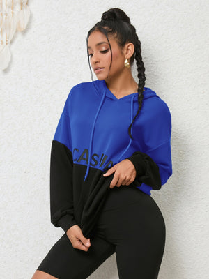 Colorblock royal blue and black graphic hoodie with "CASUAL" text detail.