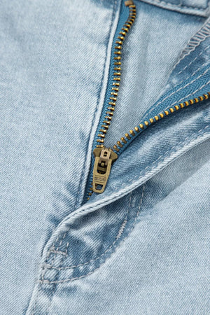 Light wash denim jeans with a brass zipper detail