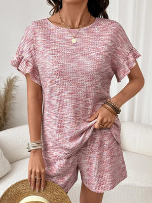 Pink ruffled sleeve two-piece set with textured fabric and drawstring shorts.