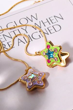 Locket Starburst Pendant Necklaces in lavender and yellow-green with crystal accents on gold chains.