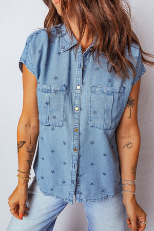 Light wash denim shirt with all-over dark stars, short sleeves, button front, and two chest pockets.
