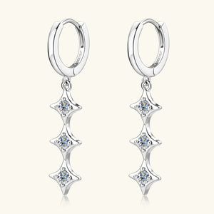 Silver hoop earrings with three cascading star-shaped moissanite charms.