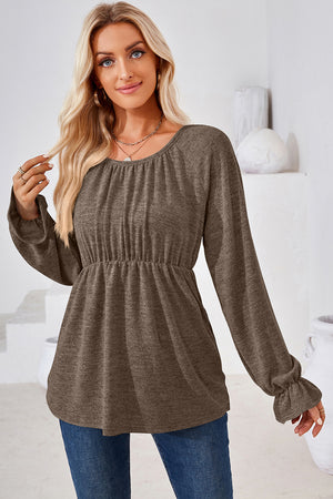 Mocha long sleeve blouse with cinched waist and ruffled cuffs.