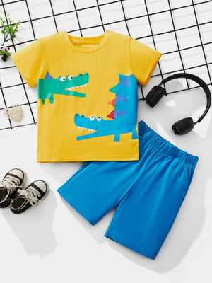 Toddler yellow cotton tee with blue and green crocodile print and blue shorts.