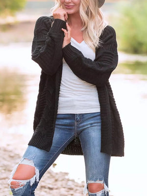 Black cable knit duster cardigan with textured pattern and long sleeves.