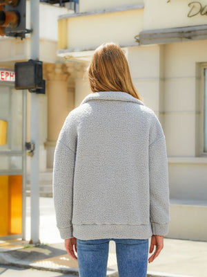 Charcoal sherpa zip jacket with quilted panels and a collar, shown from the back.