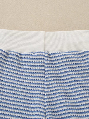 Baby knit set with blue and white stripes and a white ribbed waistband.