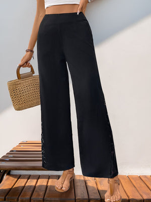 Black palazzo trousers with lace inset detail and wide leg cut.