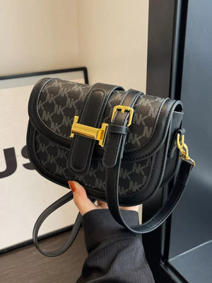 Black monogram flap crossbody bag with gold buckle detail
