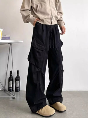 Black relaxed fit cargo pants with drawstring and multi pockets.