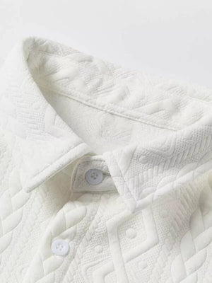 White knit polo shirt with textured geometric pattern and button placket detail.
