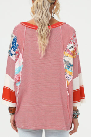 Patchwork stripe raglan sleeve tee in deep red with colorful floral print panels on sleeves.