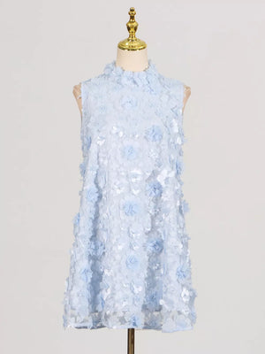 Blue floral applique mini dress with ruffled mock neck and sleeveless design.