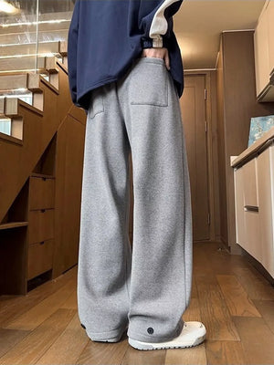 Relaxed fit grey herringbone sweatpants with ankle cuffs and a back pocket.