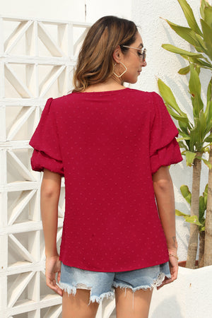 Deep Red Swiss dot blouse with tiered short sleeves and a round neckline.