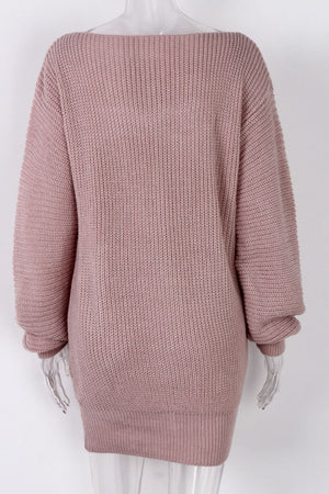 Blush pink ribbed knit mini dress with off-the-shoulder neckline and long sleeves.