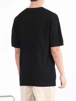 Black textured knit henley undershirt with short sleeves.
