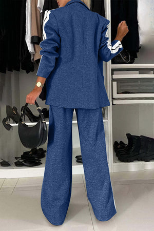 Royal blue track stripe blazer and wide leg trouser set with white stripe detail on sleeves and pant legs.